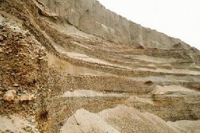 Twenty feet of glaciofluvial sand and gravel is present beneath six feet of till at a pit in Williams County. Lenses of well sorted sand are present between layers of moderate to coarse gravel. 